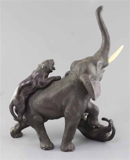 A large Japanese bronze group of tigers attacking an elephant, Meiji period, height 39cm length 31cm